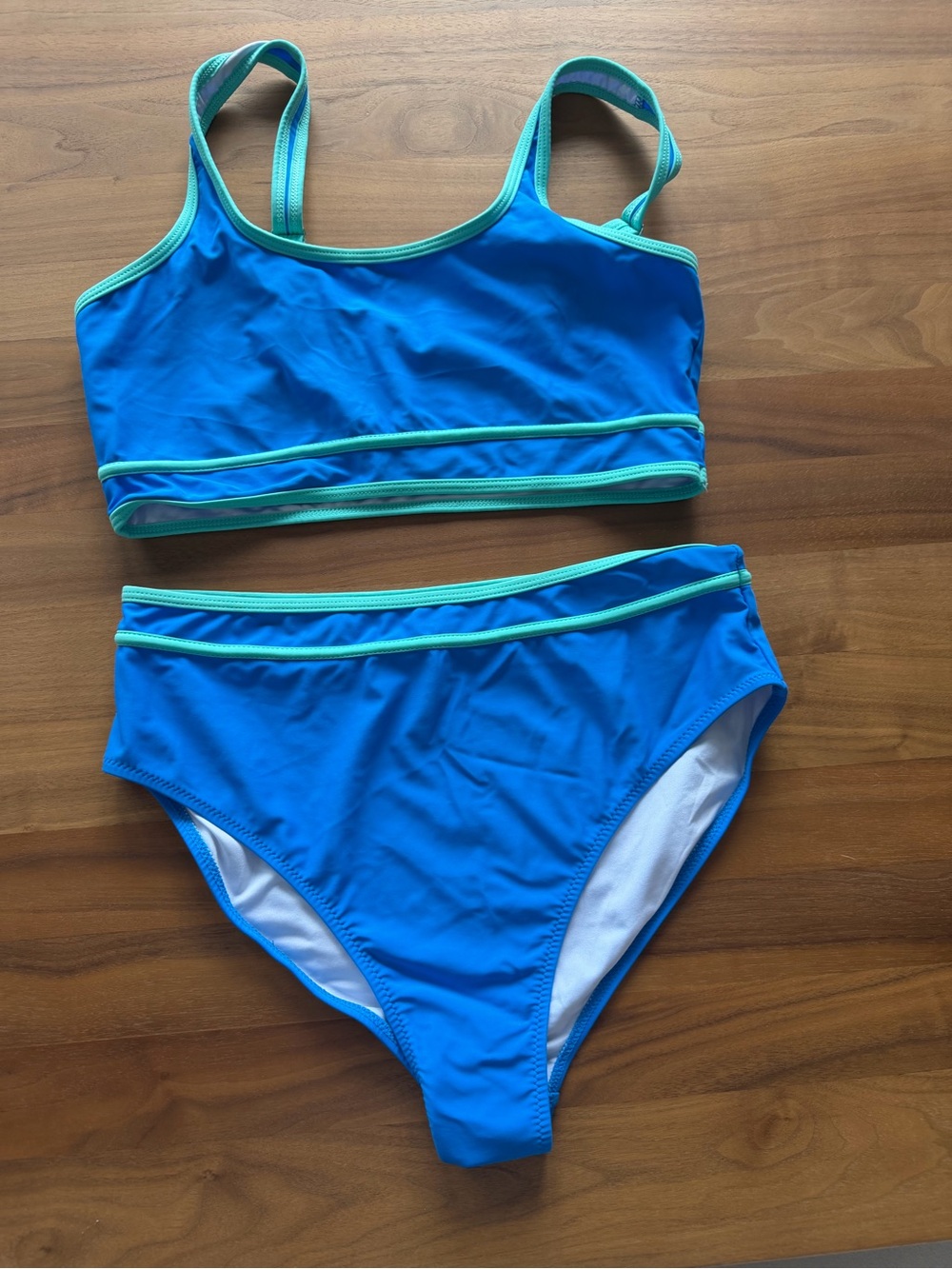 Blue Two-Piece Athletic Style Bikini Set with Aqua Trim. Size L.